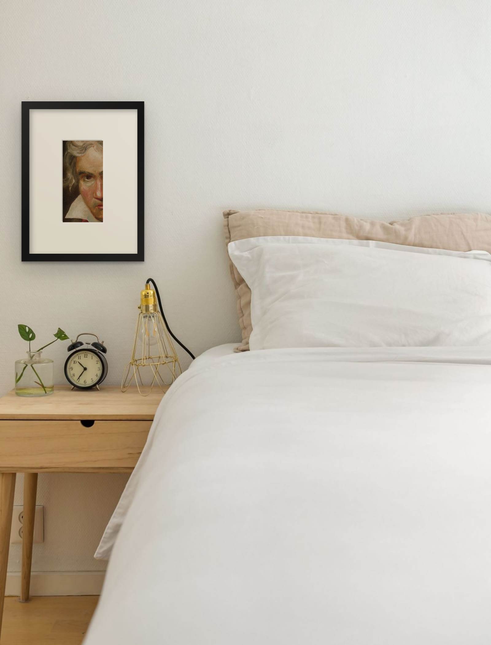 Beethoven with the Manuscript of the Missa Solemnis, art print after Joseph Karl Stieler by Riya Kumari, framed beside a bed