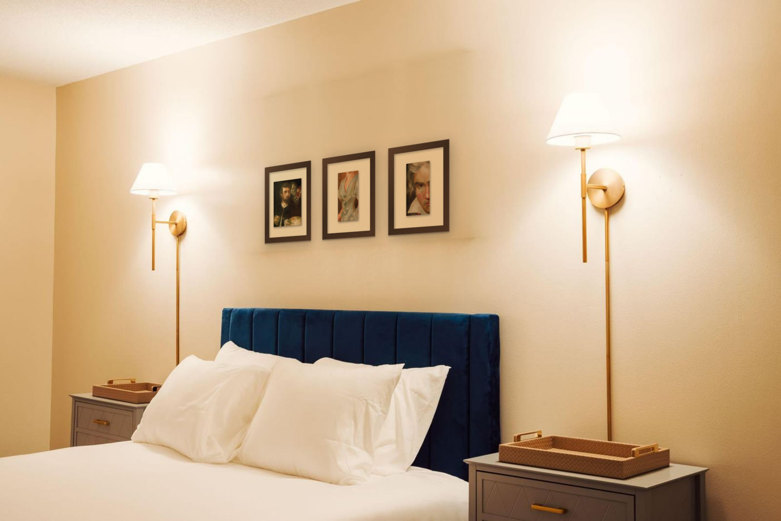 Mrs Henry White, hand-painted oil painting after John Singer Sargent by Riya Kumari, framed above a hotel bed, with two other pieces