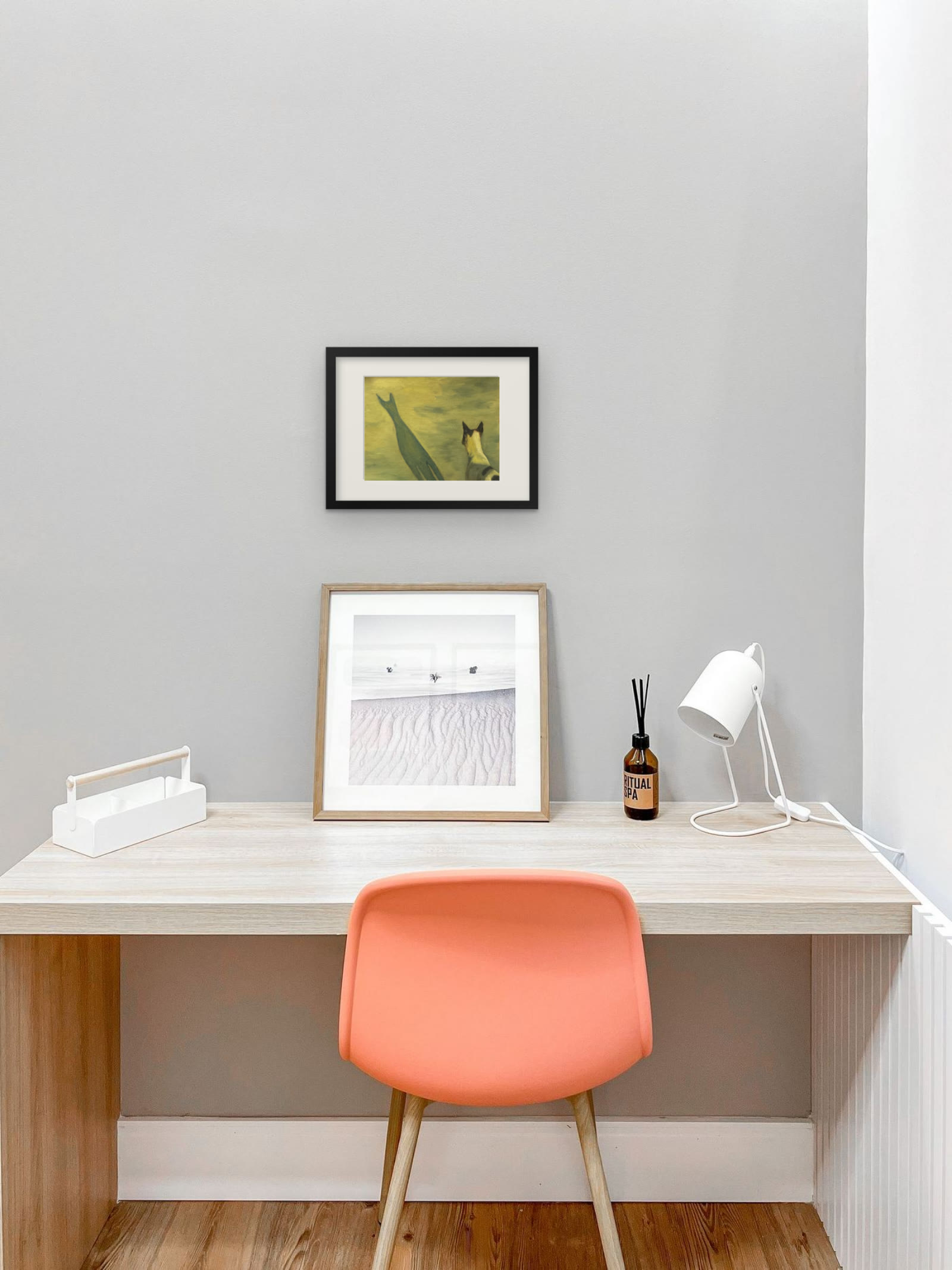 The Dog and his Shadow, art print by Riya Kumari, framed above a desk
