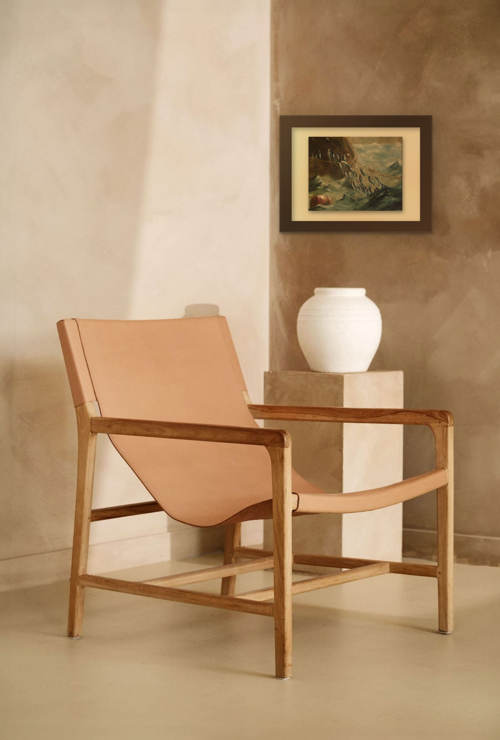 The Herring Net, hand-painted oil painting after Winslow Homer by Riya Kumari, framed on a limewash wall by a reading chair