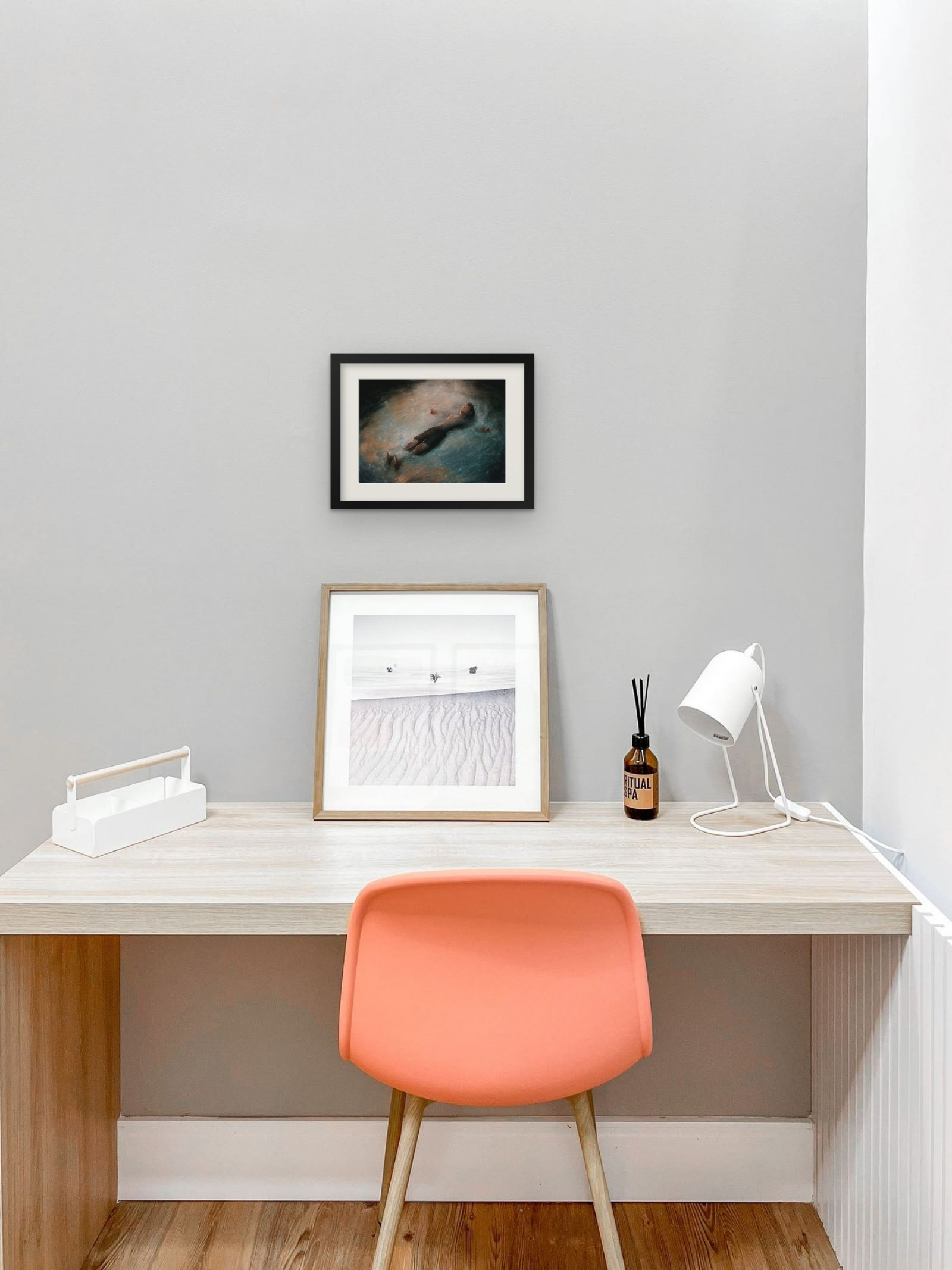 Wait, art print by Riya Kumari, framed above a desk
