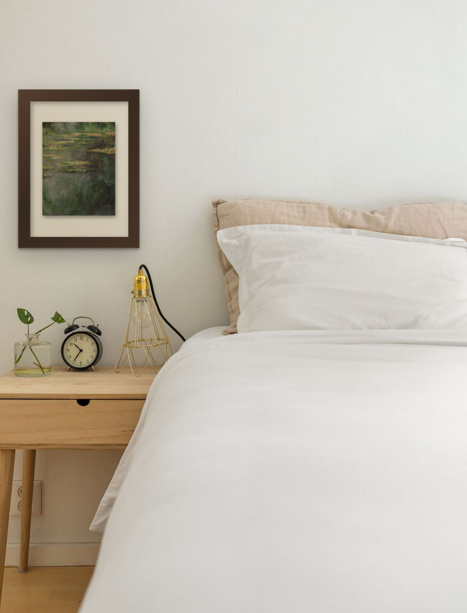 Water Lilies, hand-painted oil painting after Claude Monet by Riya Kumari, framed beside a bed
