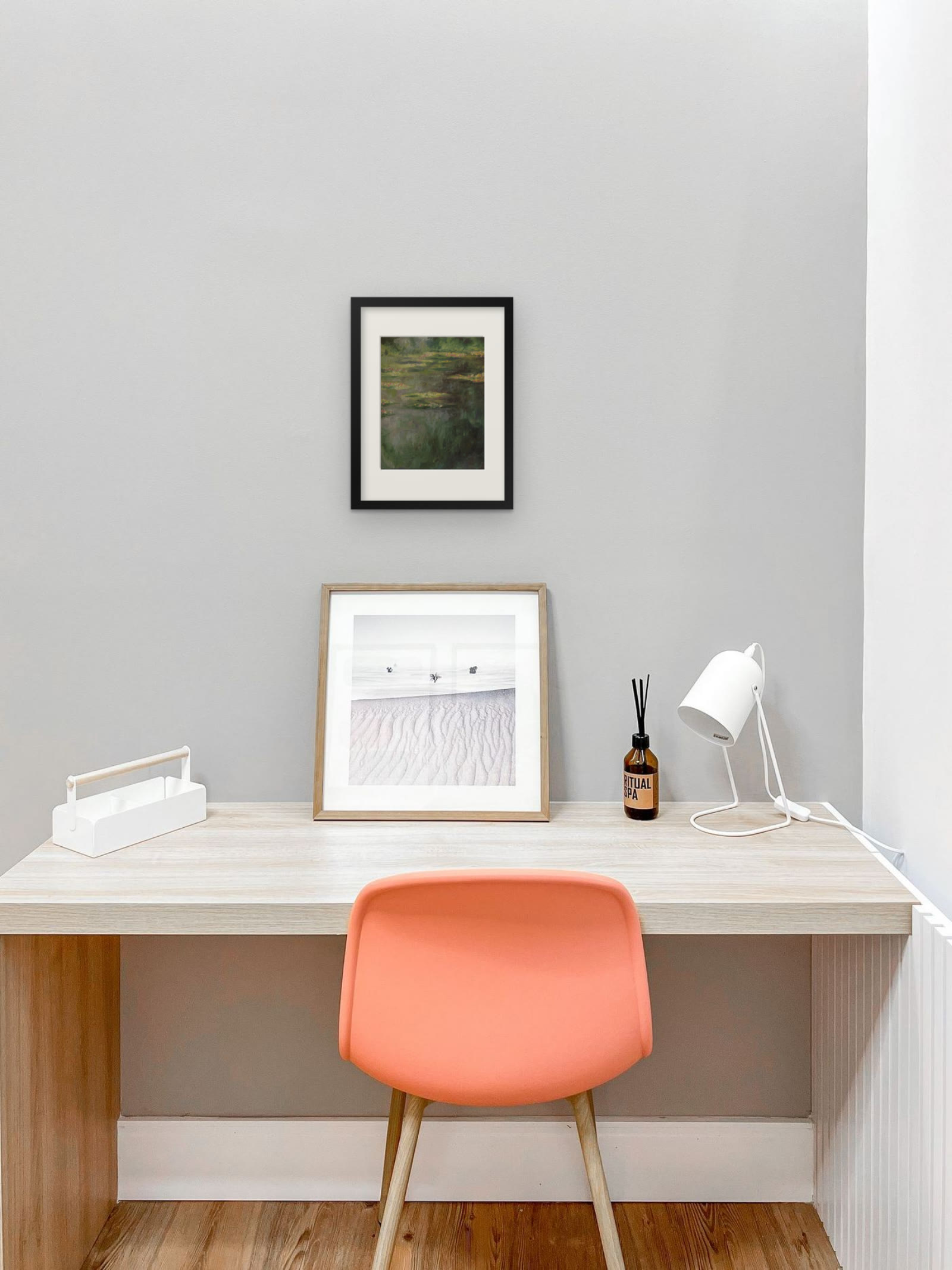 Water Lilies, art print after Claude Monet by Riya Kumari, framed above a desk